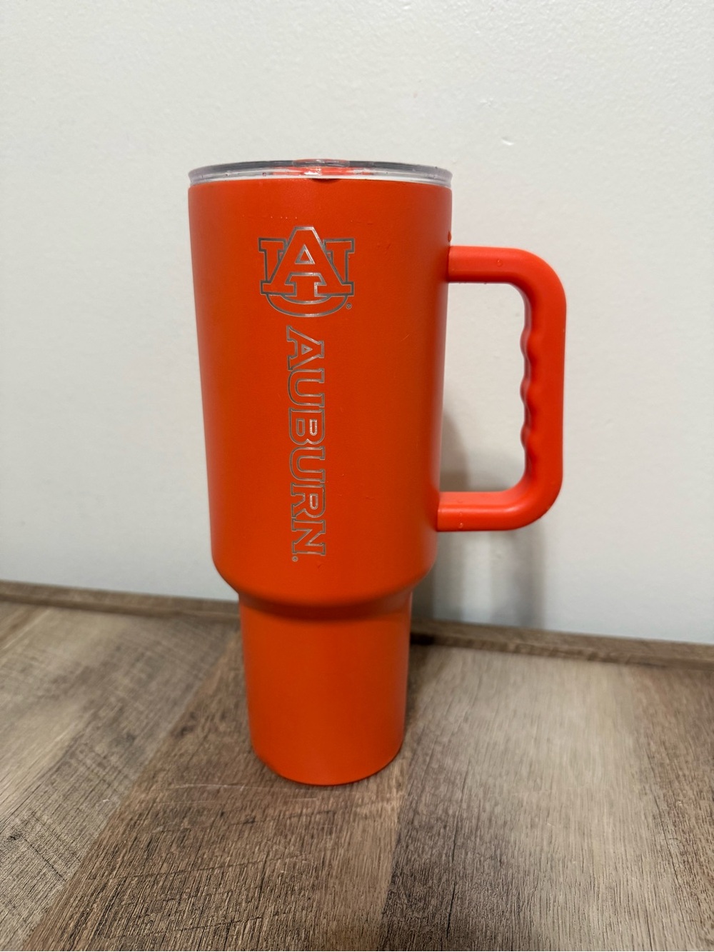 Neon orange 40oz tumbler with handle - Auburn engraved on side